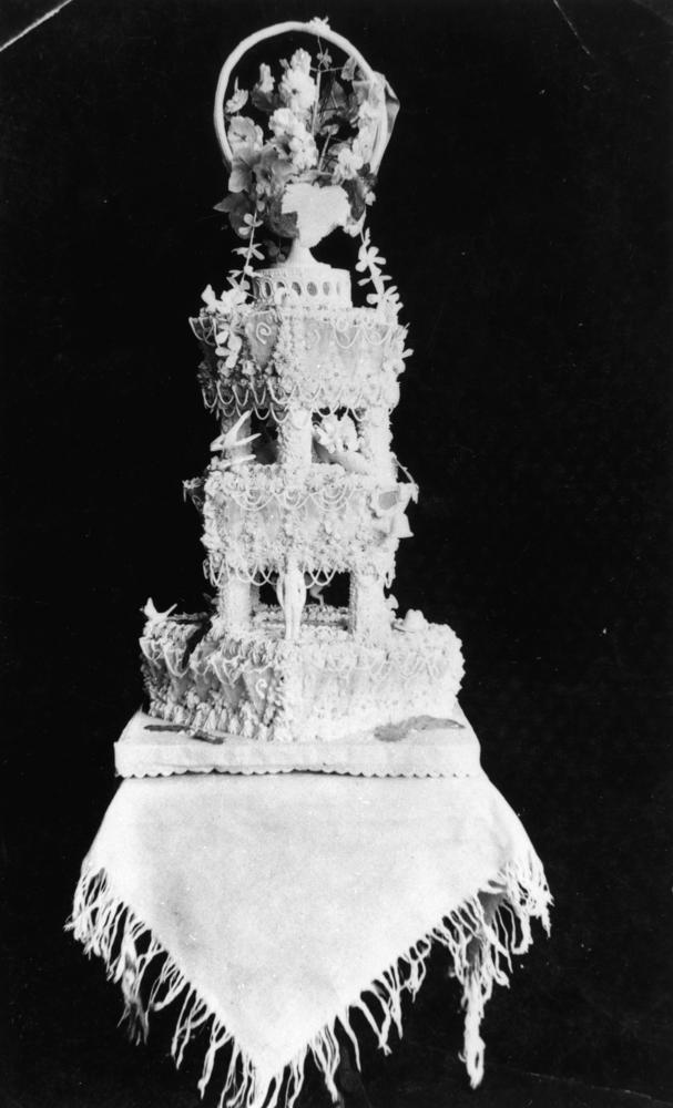 An ornate three-tier wedding cake photographed in Brisbane in 1915